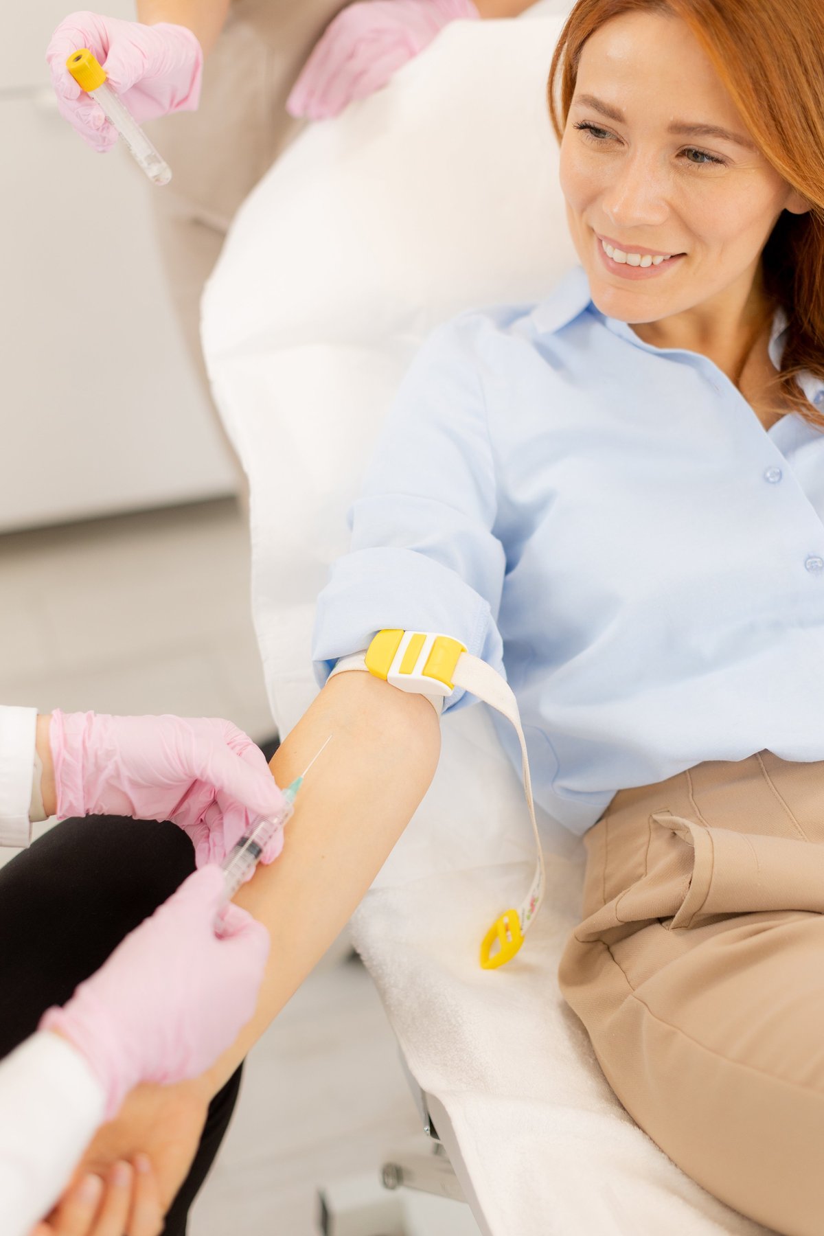 A healthcare professional working with a cheerful patient, representing workplace health programs